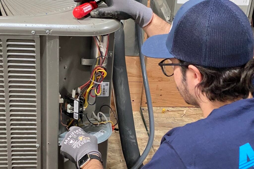 ac tech performing maintenance in San Diego